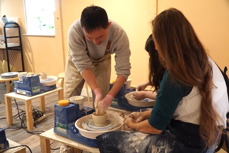 Teaching a pottery class at Olomana Studios